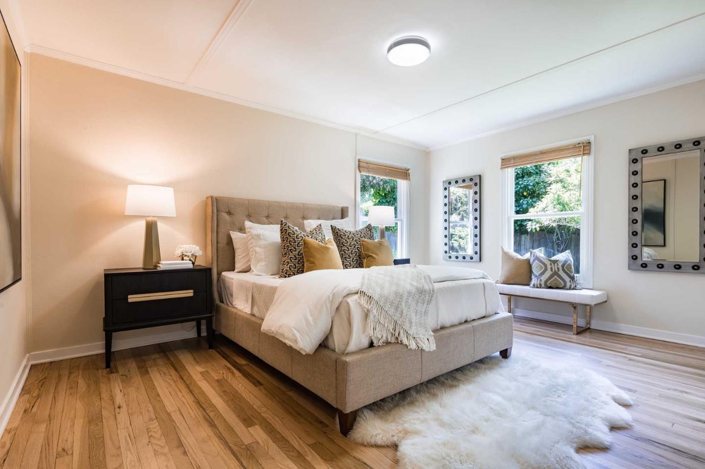 1110 Embarcadero Road Palo Alto, CA 94303 - Photo 14 of 23 a bed room with a bed and wooden floor