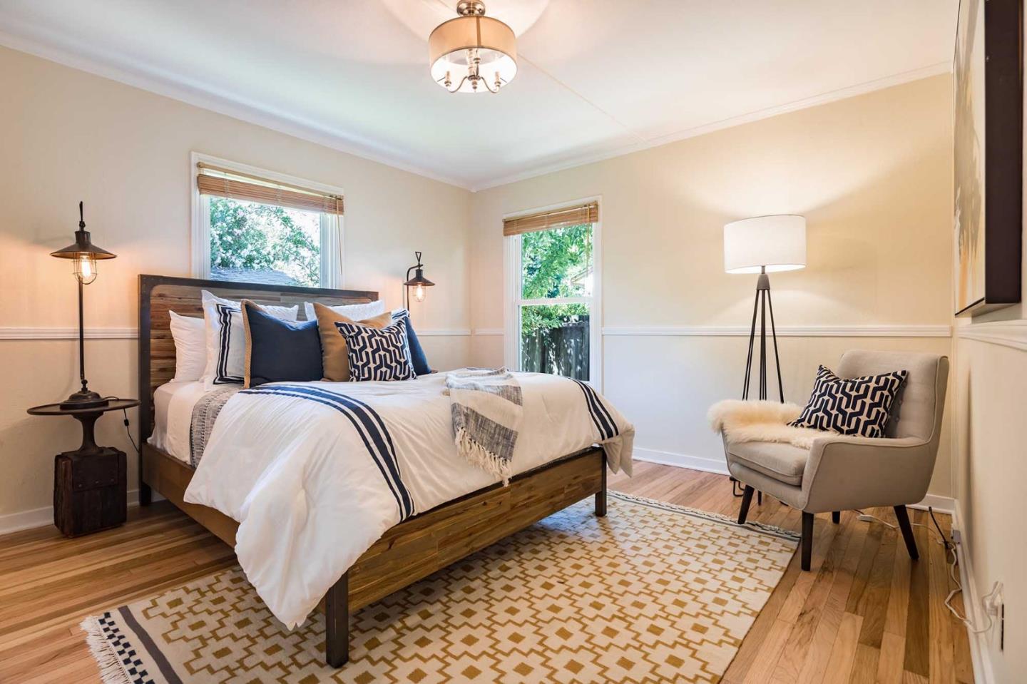 1110 Embarcadero Road Palo Alto, CA 94303 - Photo 16 of 23 a bedroom with a bed and a table