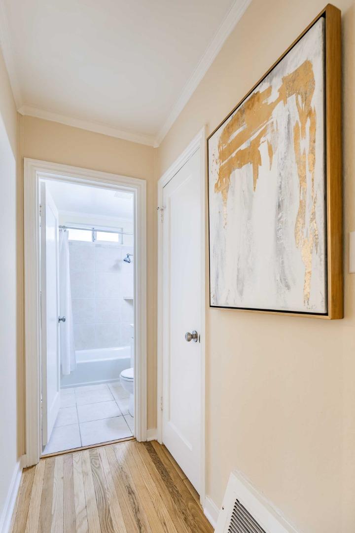 1110 Embarcadero Road Palo Alto, CA 94303 - Photo 18 of 23 a view of a hallway with wooden floor and closet
