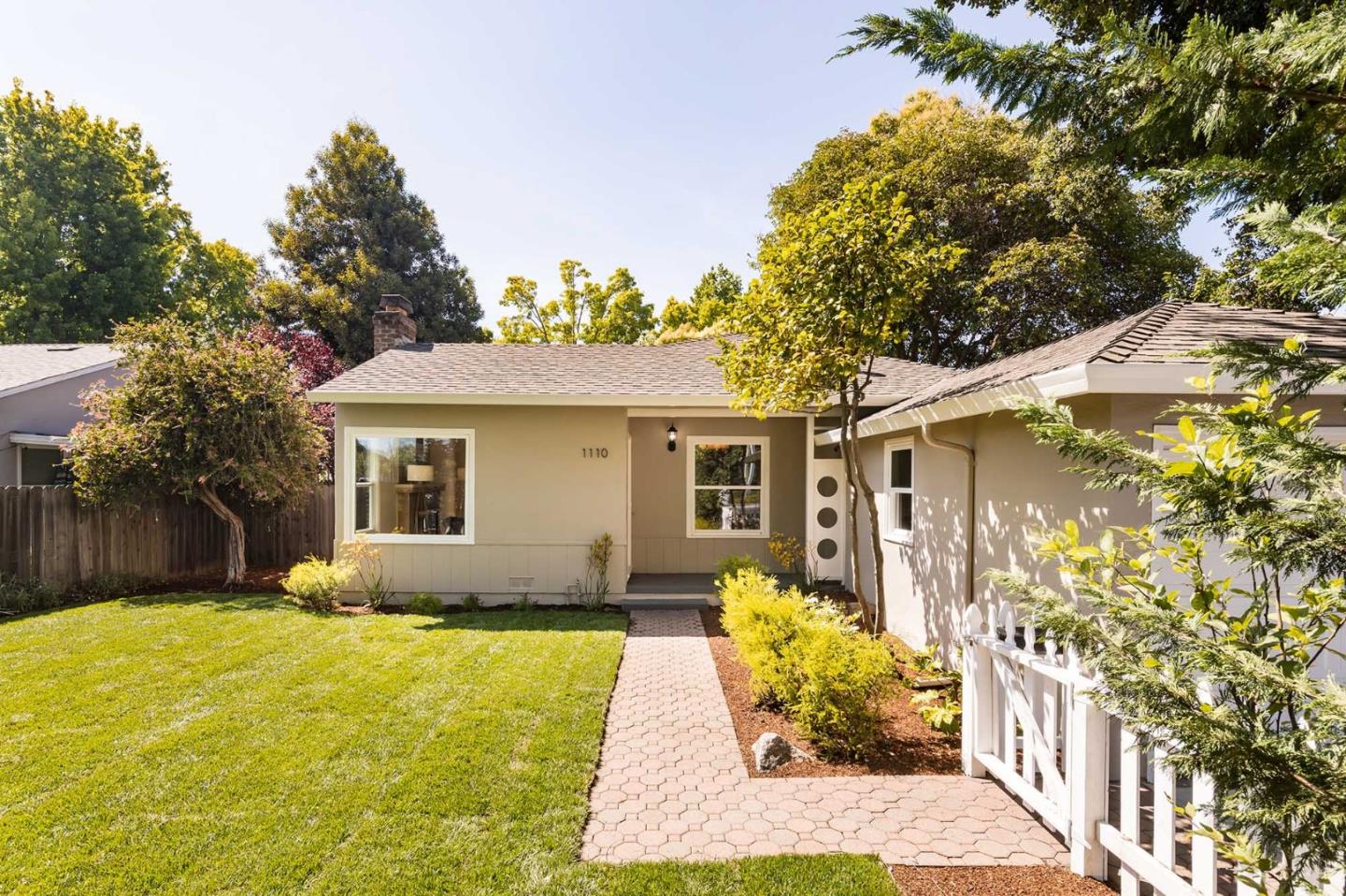 1110 Embarcadero Road Palo Alto, CA 94303 - Photo 2 of 23 a front view of a house with yard