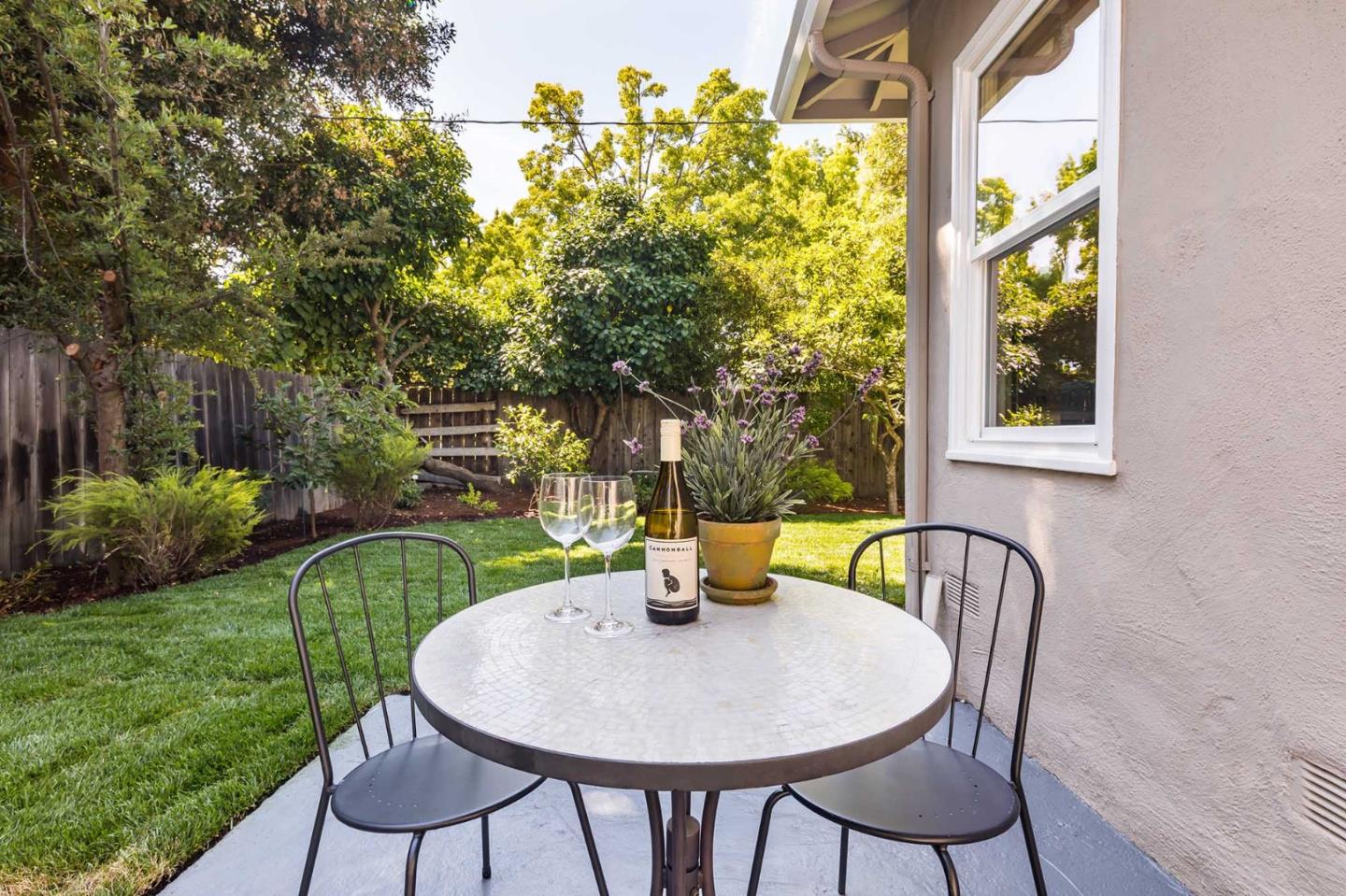 1110 Embarcadero Road Palo Alto, CA 94303 - Photo 23 of 23 a backyard of a house with table and chairs