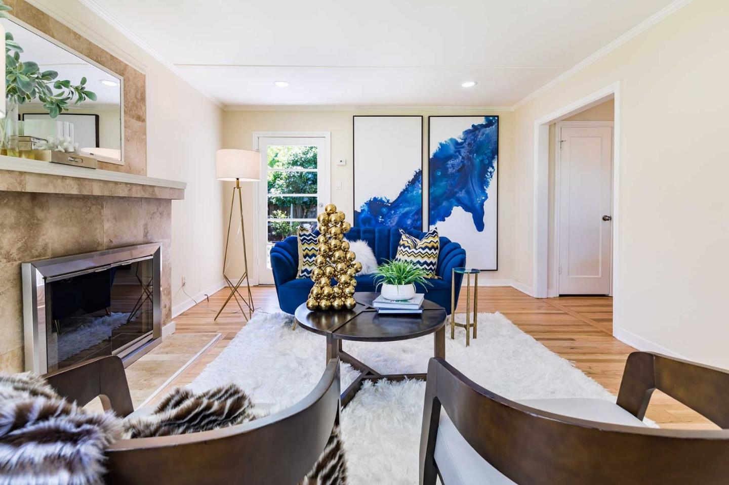 1110 Embarcadero Road Palo Alto, CA 94303 - Photo 7 of 23 a living room with furniture and a fireplace