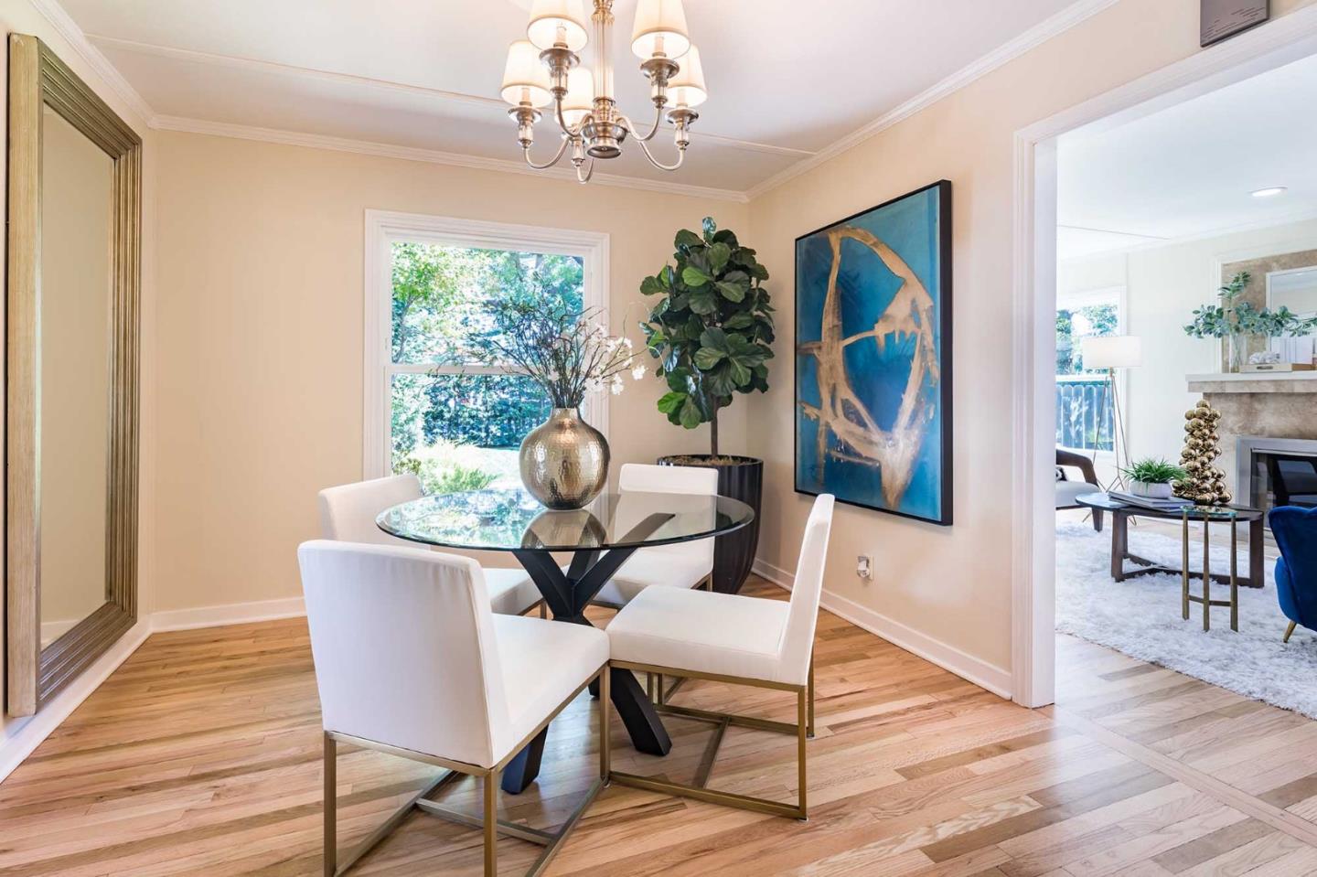 1110 Embarcadero Road Palo Alto, CA 94303 - Photo 8 of 23 a view of a dining room with furniture wooden floor and a chandelier