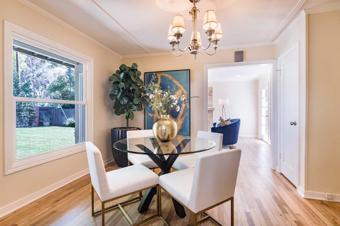 1110 Embarcadero Road Palo Alto, CA 94303 - Photo 9 of 23 a view of a dining room with furniture wooden floor and chandelier
