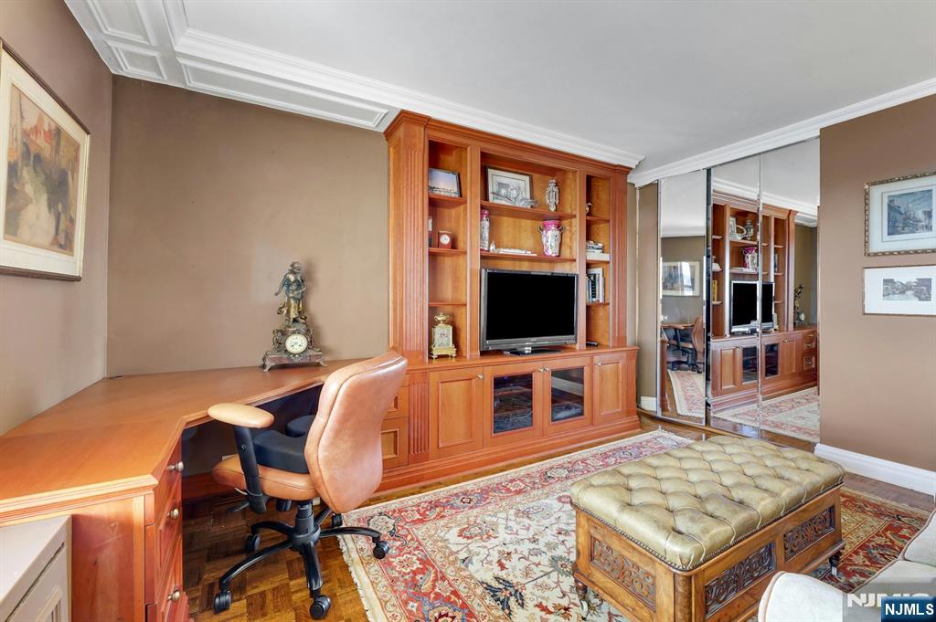 1 Horizon Road, Unit 817 Fort Lee, NJ 07024 - Photo 26 of 44 a living room with furniture and a flat screen tv