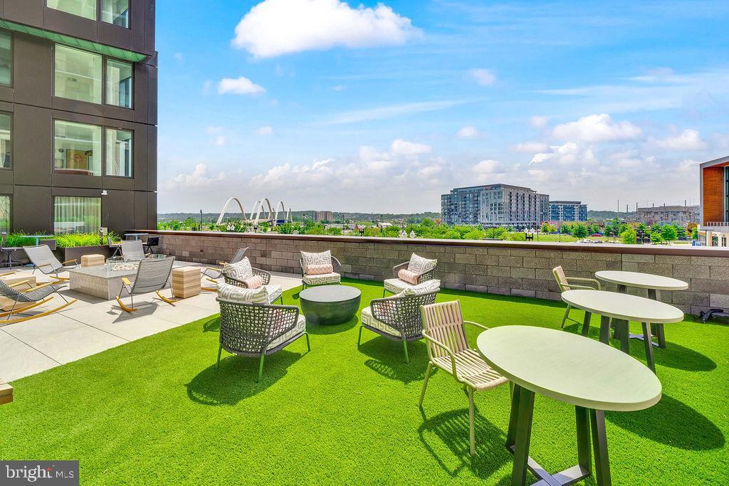 113 Potomac Avenue Southwest, Unit 332 Washington, DC 20024 - Photo 45 of 50 a view of a swimming pool and chairs in patio