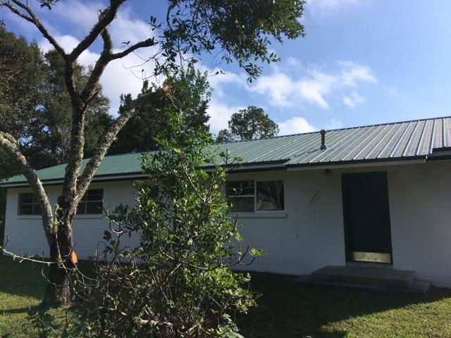 586 Mossy Bend Road Ponce de Leon, FL 32455 - Photo 2 of 17 a backyard of a house with lots of green space