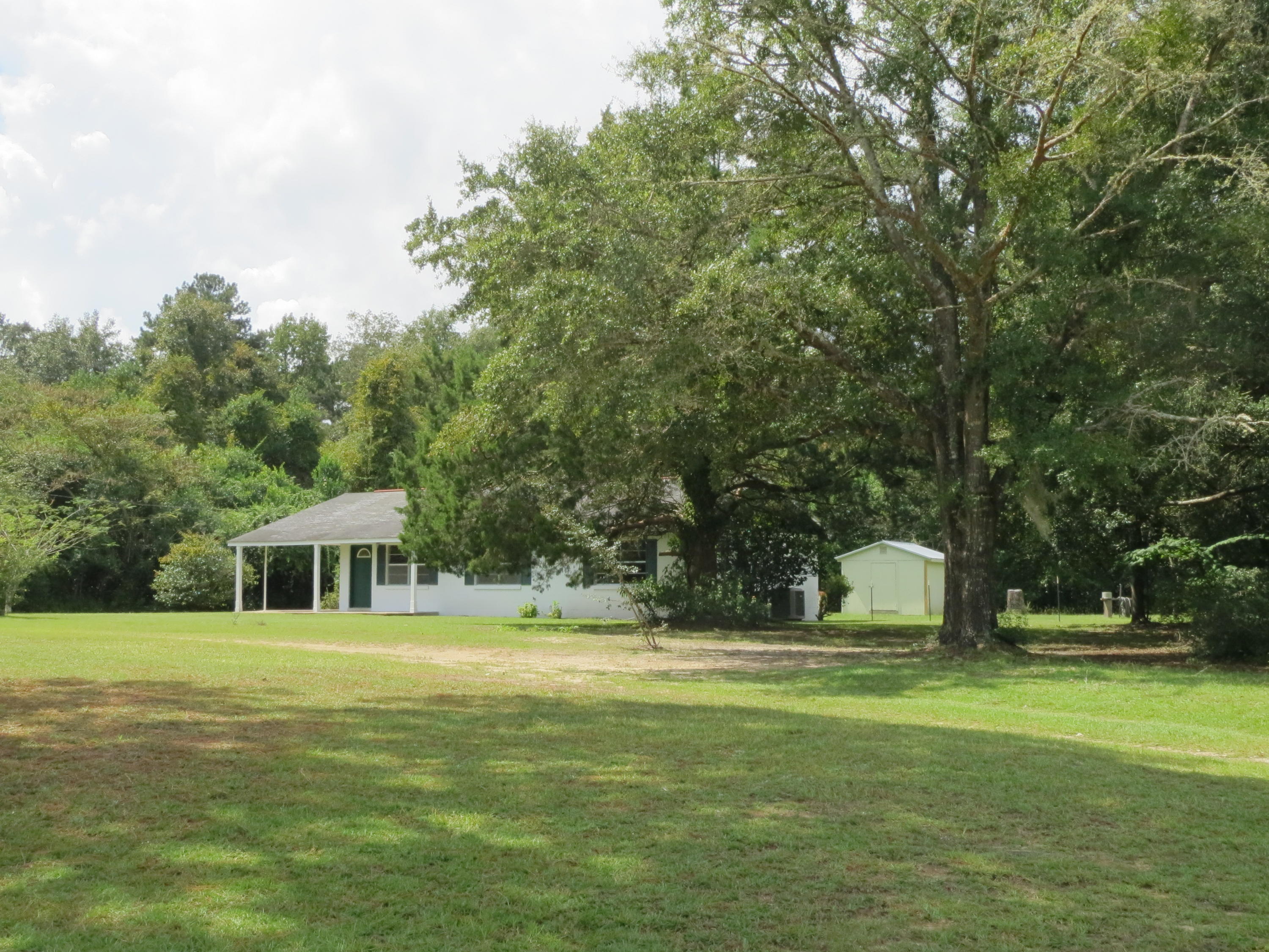 586 Mossy Bend Road Ponce de Leon, FL 32455 - Photo 17 of 17 a view of a house with a yard