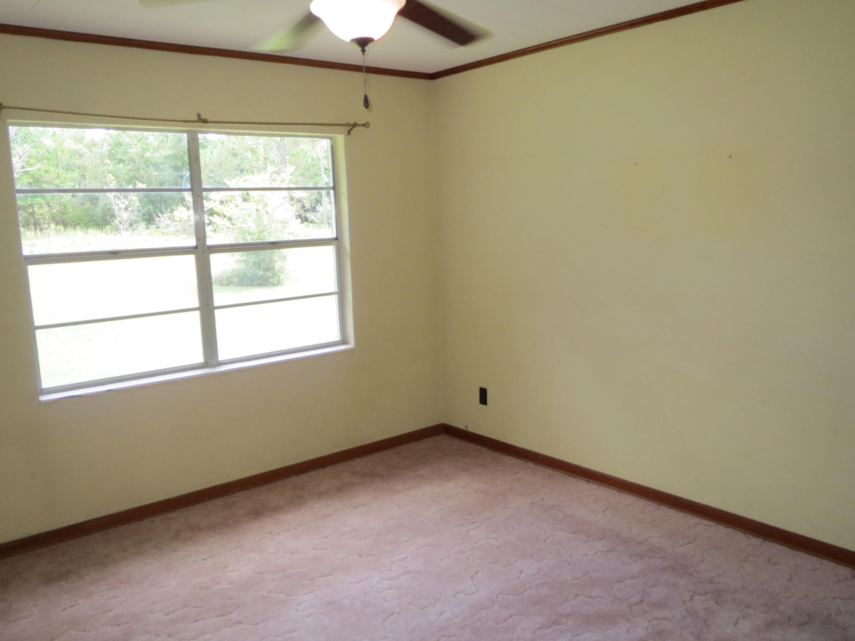 586 Mossy Bend Road Ponce de Leon, FL 32455 - Photo 7 of 17 an empty room with a window