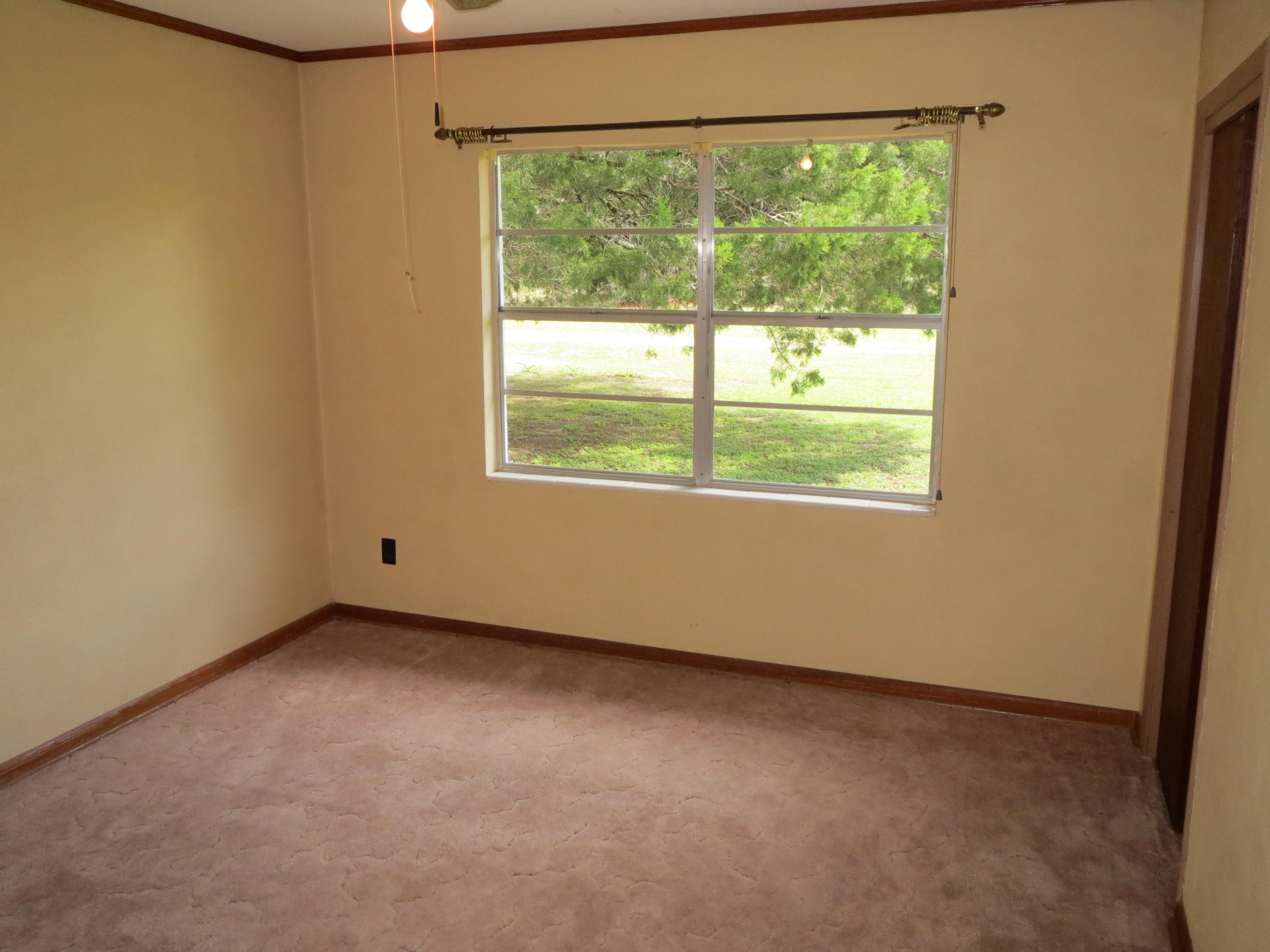 586 Mossy Bend Road Ponce de Leon, FL 32455 - Photo 8 of 17 an empty room with a window