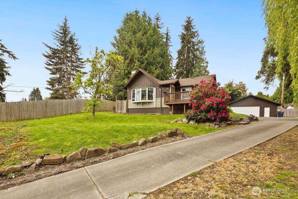 a front view of a house with garden