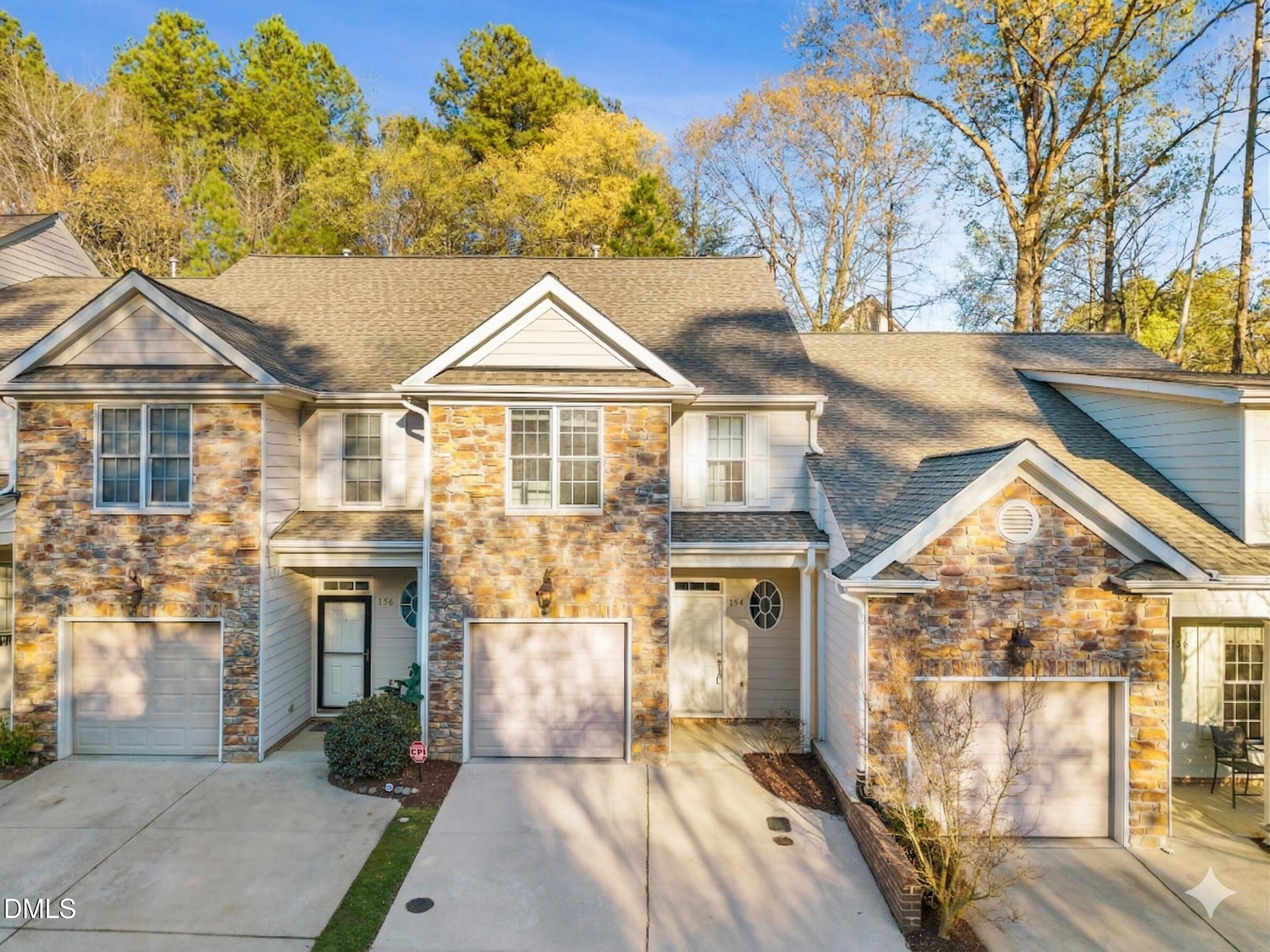 2822 Pickett Road, Unit 154 Durham, NC 27705 - Photo 1 of 31 a front view of a house with a yard