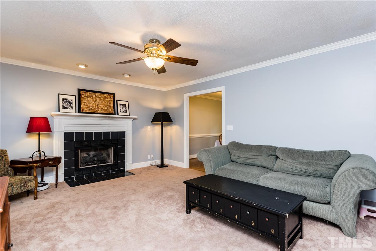2228 Bufflehead Road Raleigh, NC 27616 - Photo 2 of 20 a living room with furniture and a fireplace