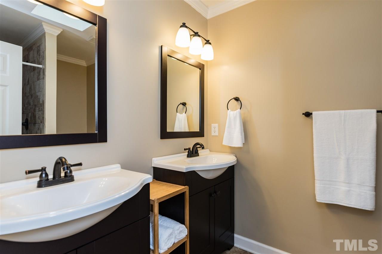 2228 Bufflehead Road Raleigh, NC 27616 - Photo 12 of 20 a bathroom with a sink and a mirror