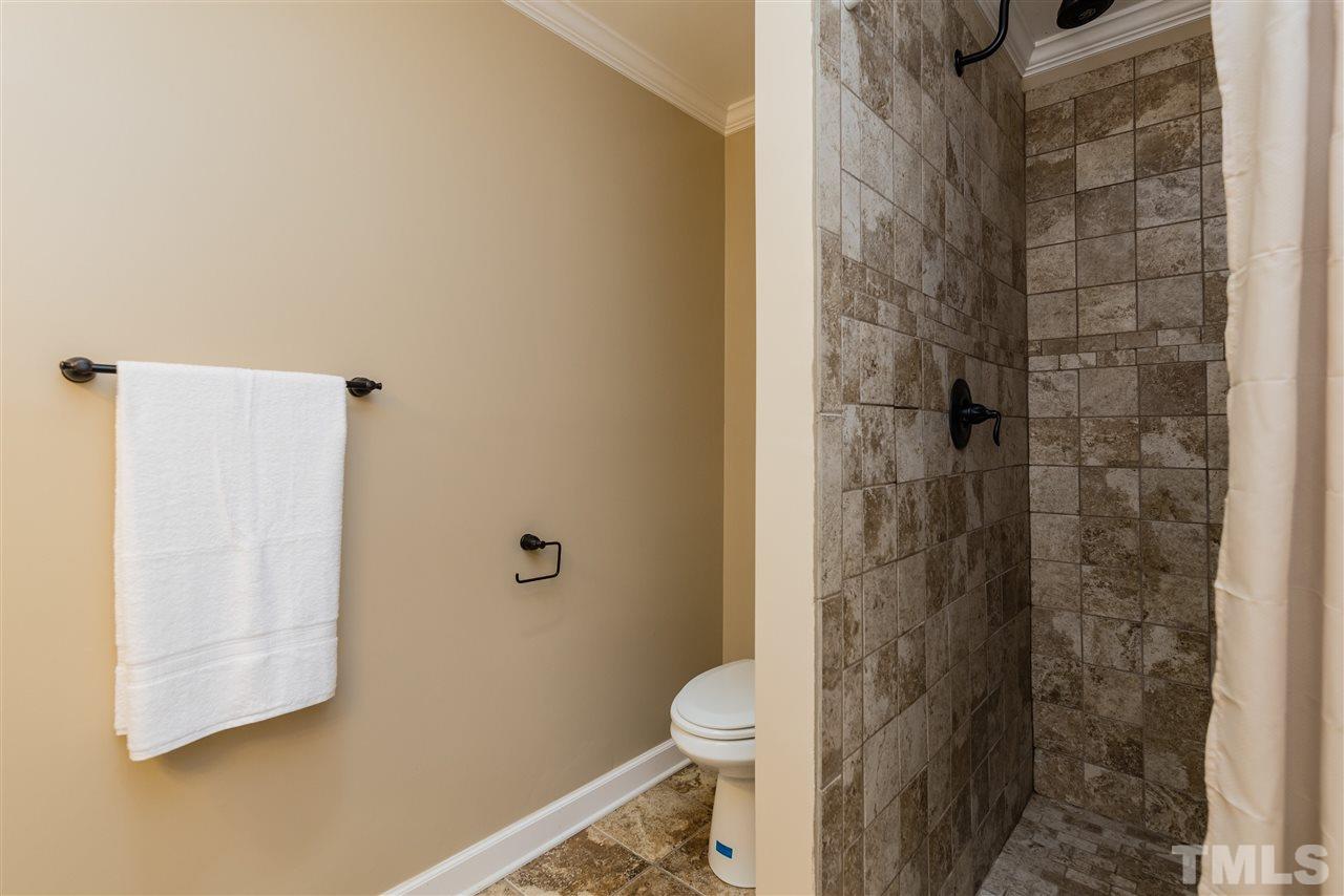 2228 Bufflehead Road Raleigh, NC 27616 - Photo 13 of 20 a bathroom with a toilet and shower