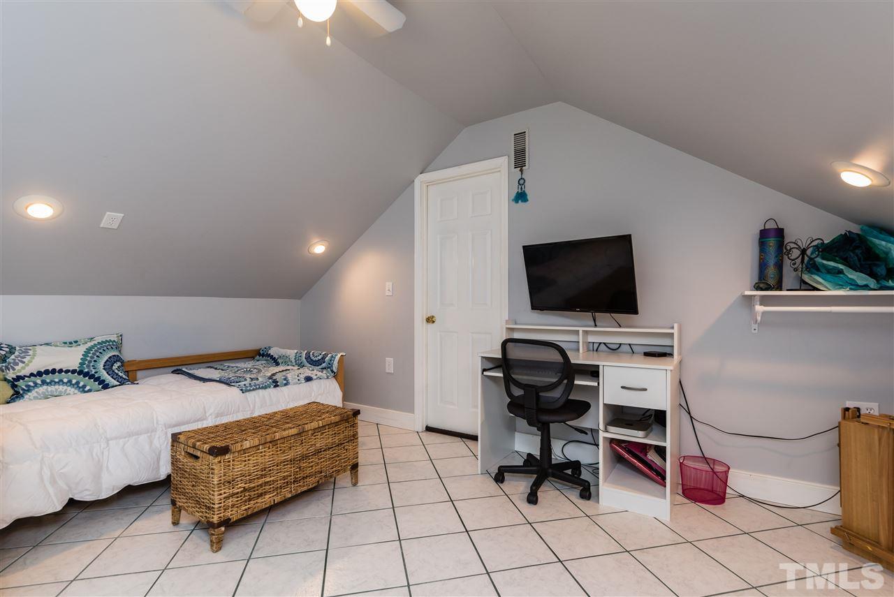 2228 Bufflehead Road Raleigh, NC 27616 - Photo 17 of 20 a bedroom with a bed and flat screen tv