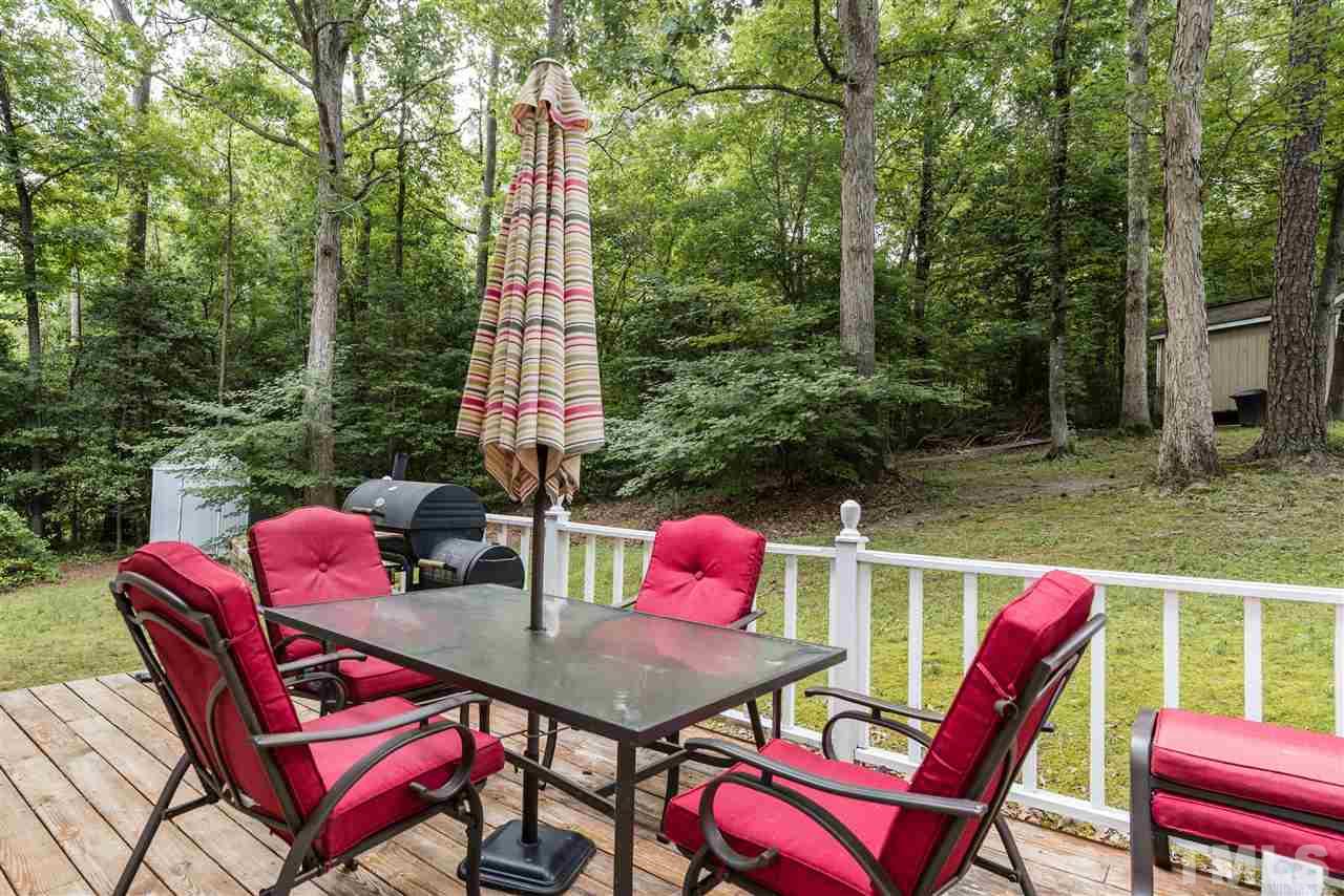 2228 Bufflehead Road Raleigh, NC 27616 - Photo 19 of 20 a patio with a table and chairs