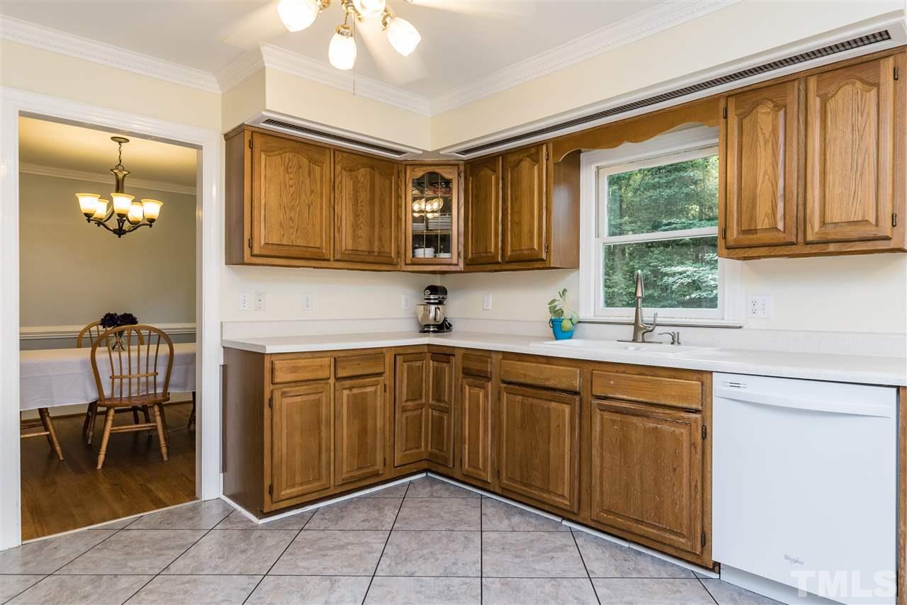 2228 Bufflehead Road Raleigh, NC 27616 - Photo 6 of 20 a kitchen with a sink cabinets and appliances