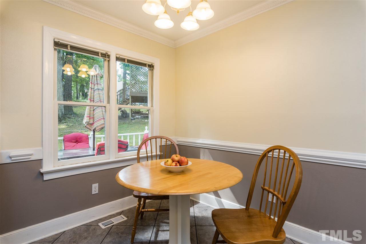 2228 Bufflehead Road Raleigh, NC 27616 - Photo 9 of 20 a view of a dining room with furniture window and outside view
