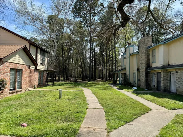 a view of a backyard with a small cabin