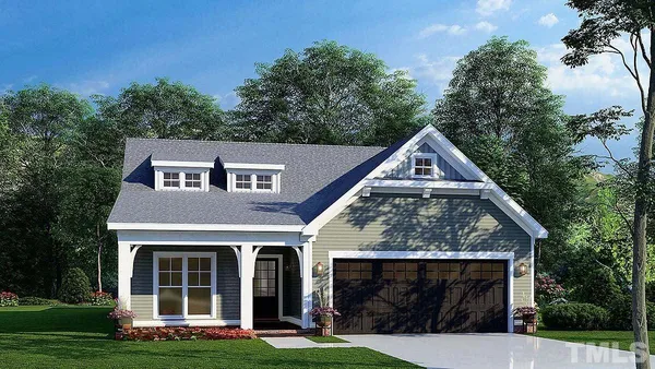 a view of a house with yard and garden