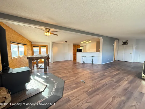 a view of a living room and kitchen