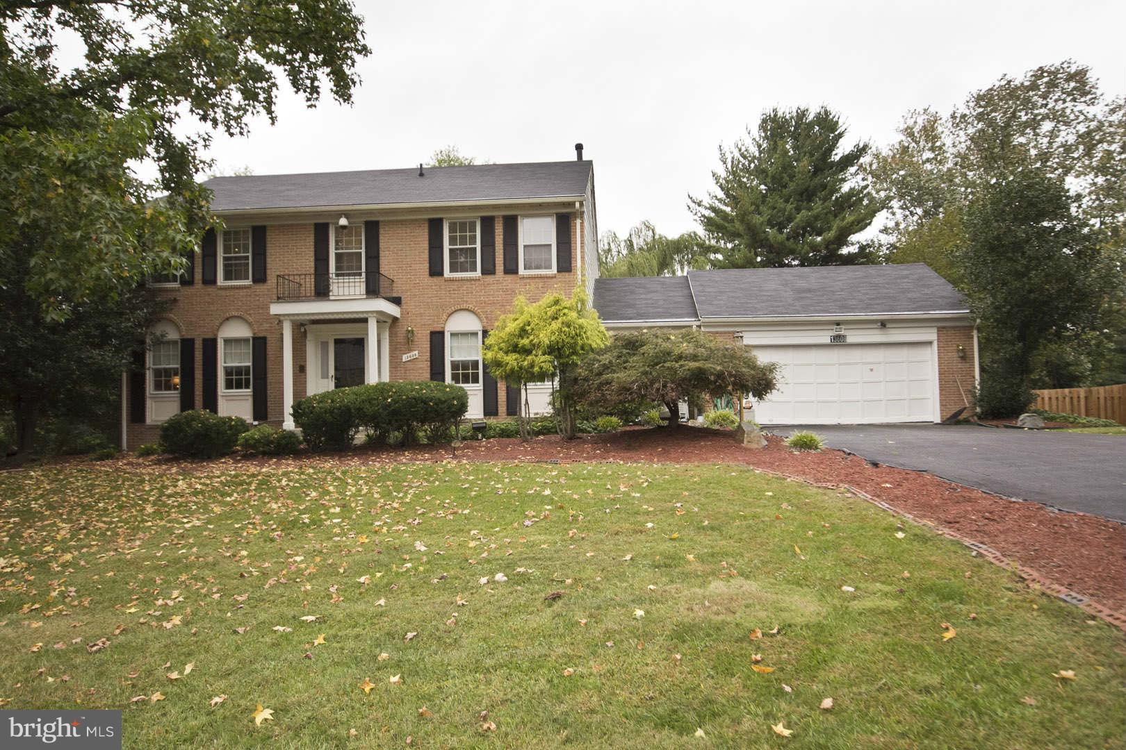 13608 Turnmore Road Silver Spring, MD 20906 - Photo 1 of 30 a front view of a house with a yard and garage