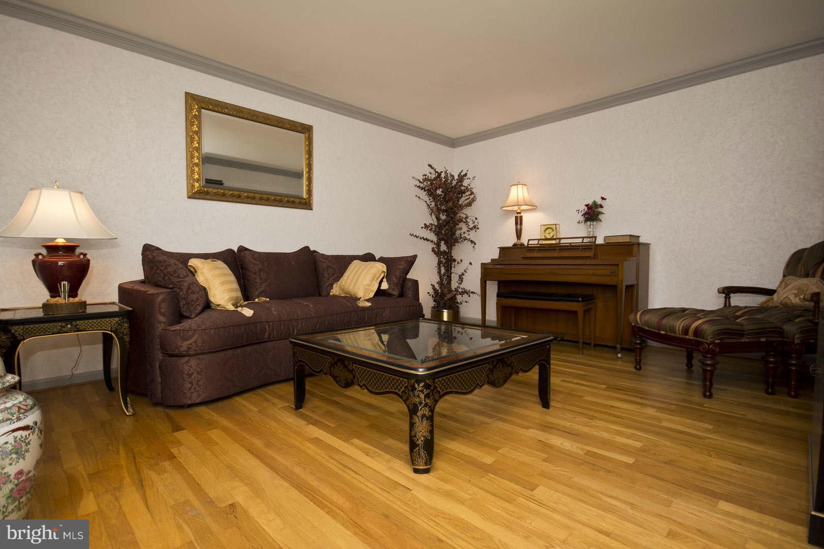 13608 Turnmore Road Silver Spring, MD 20906 - Photo 3 of 30 a living room with furniture and a piano