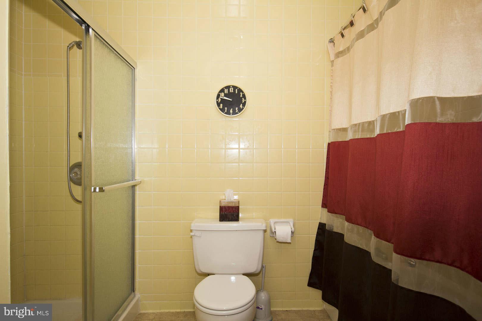 13608 Turnmore Road Silver Spring, MD 20906 - Photo 23 of 30 a bathroom with a toilet and a shower