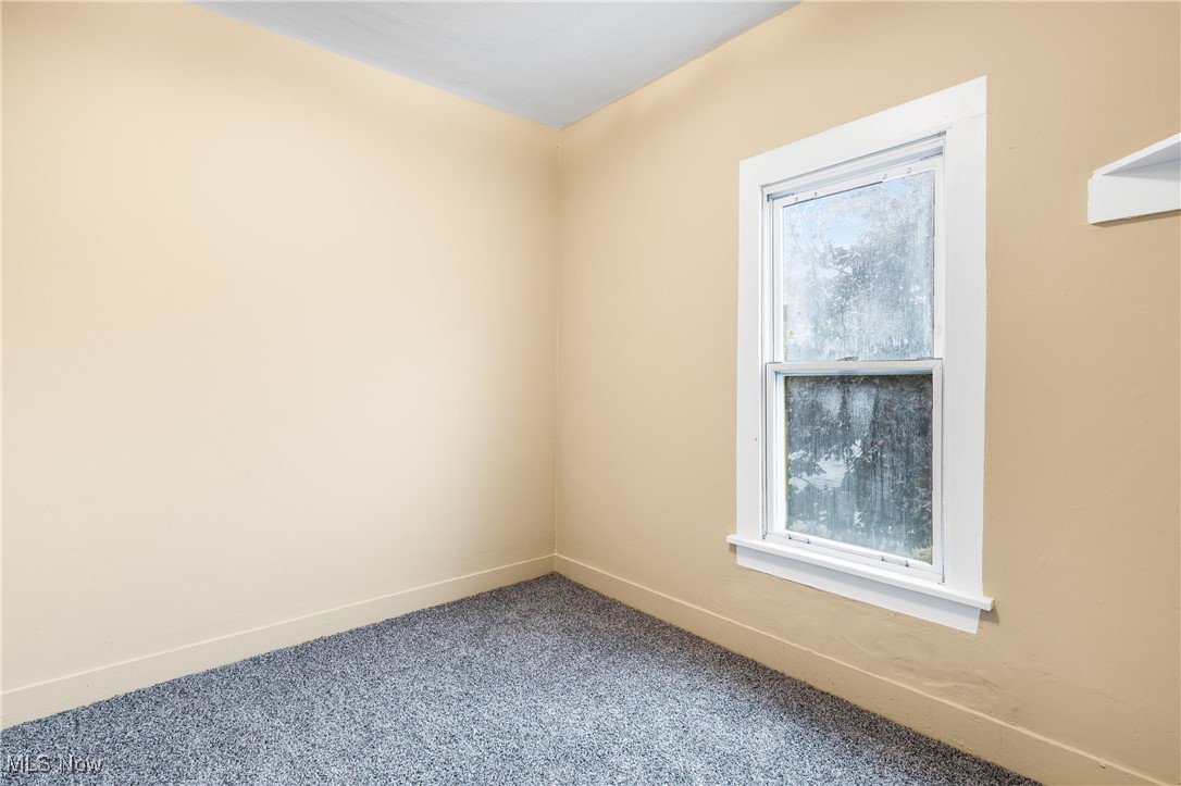 7529 State Line Burghill, OH 44404 - Photo 16 of 23 Carpeted empty room with baseboards