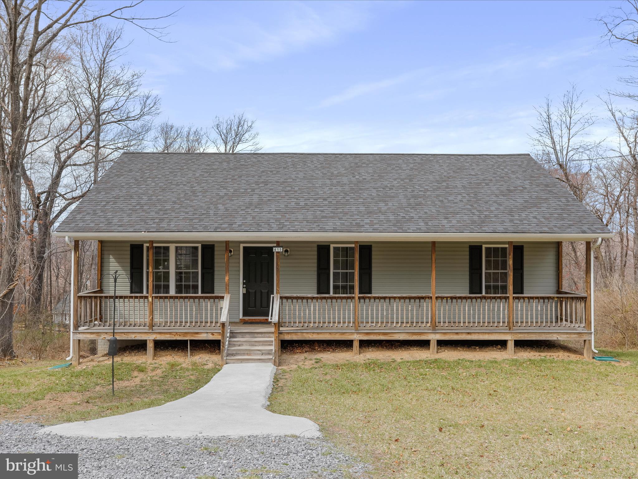 front view of a house with a yard