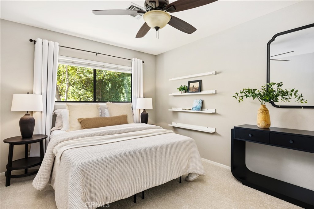 6030 Portola Road Atascadero, CA 93422 - Photo 18 of 44 a bedroom with a bed and a potted plant