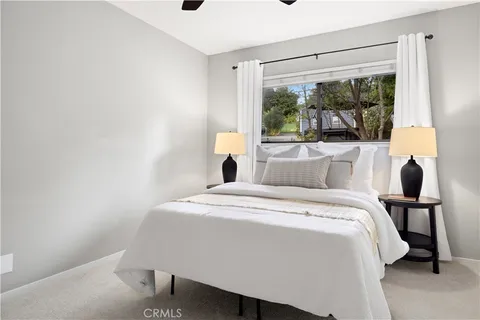 a bedroom with a bed and window