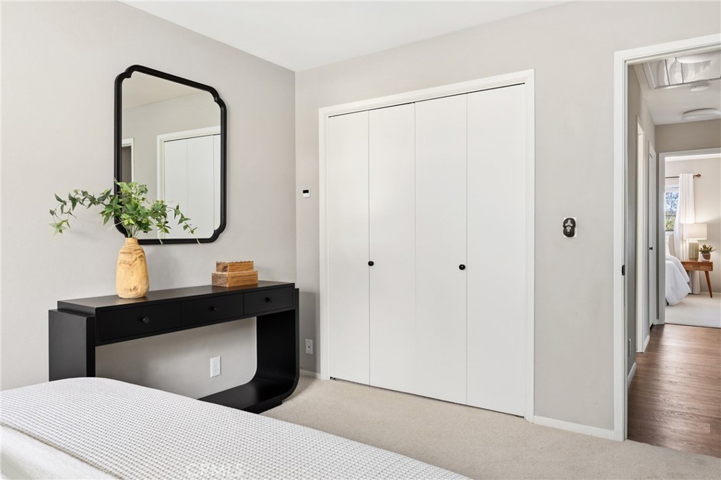 6030 Portola Road Atascadero, CA 93422 - Photo 20 of 44 a bedroom with a bed and a potted plant