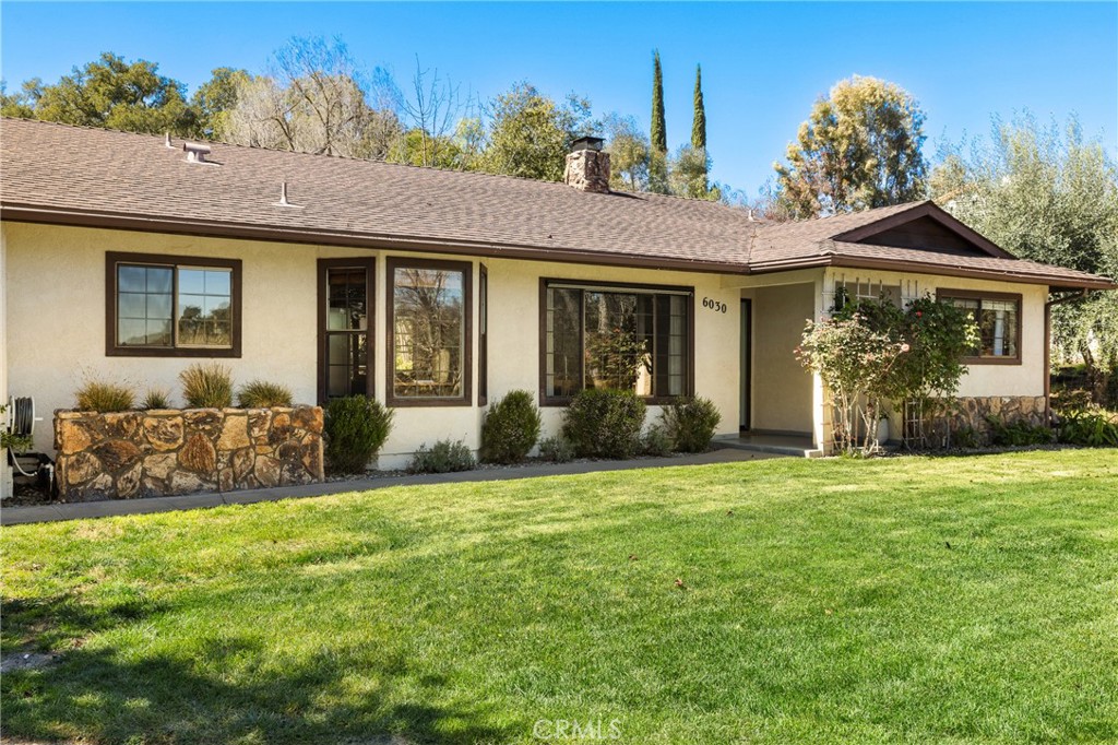 6030 Portola Road Atascadero, CA 93422 - Photo 2 of 44 a front view of a house with a yard