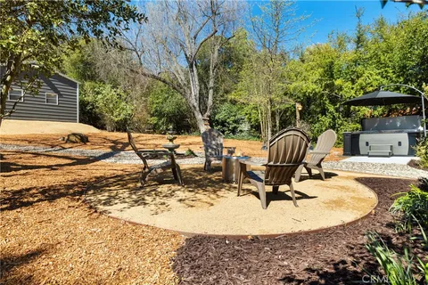 a view of a backyard with sitting area