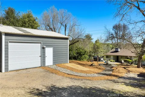 a backyard of a house with yard and outdoor seating
