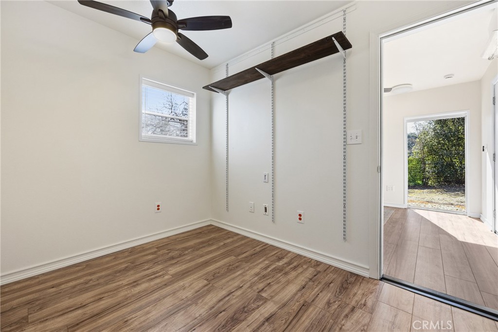 6030 Portola Road Atascadero, CA 93422 - Photo 38 of 44 a view of empty room with wooden floor and fan