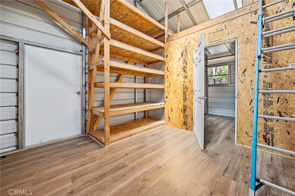 6030 Portola Road Atascadero, CA 93422 - Photo 39 of 44 a view of an empty room with wooden floor and a window