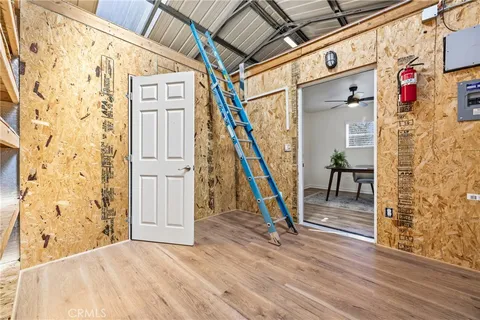 a view of a livingroom with furniture and wooden floor