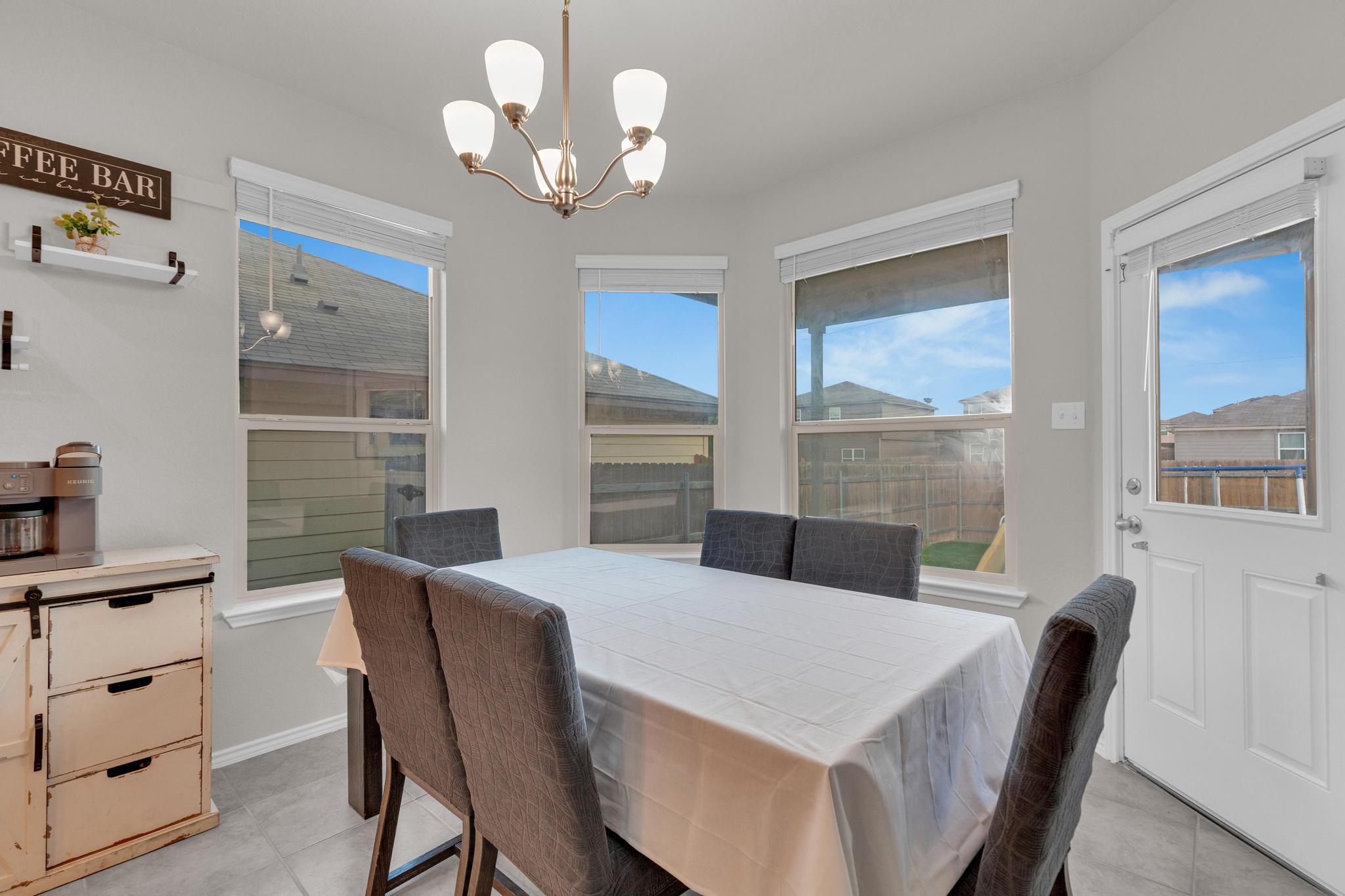 104 Uncle Billy Way Jarrell, TX 76537 - Photo 17 of 38 A well-lit dining area offers ample space for gathering, complemented by a convenient coffee bar.