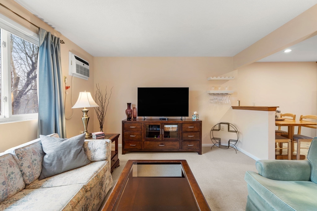 62 Purchase Street, Unit C5 Danvers, MA 01923 - Photo 11 of 22 a living room with furniture and a flat screen tv