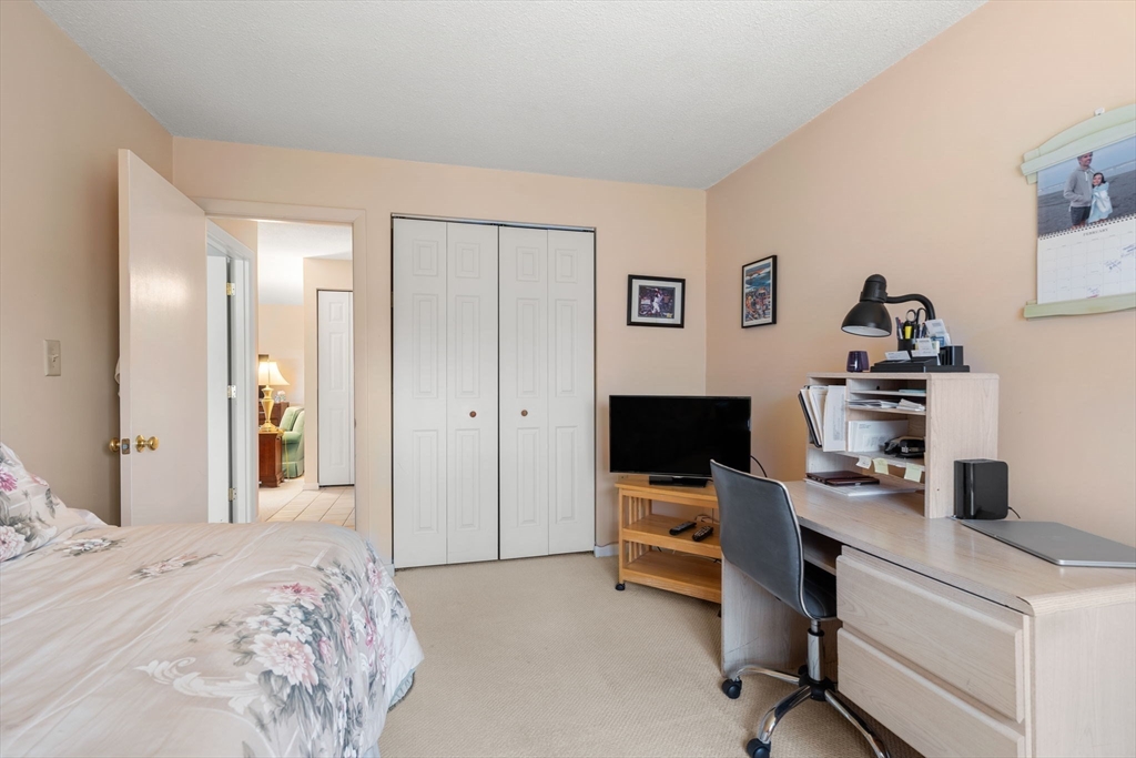 62 Purchase Street, Unit C5 Danvers, MA 01923 - Photo 17 of 22 a bedroom with a workspace