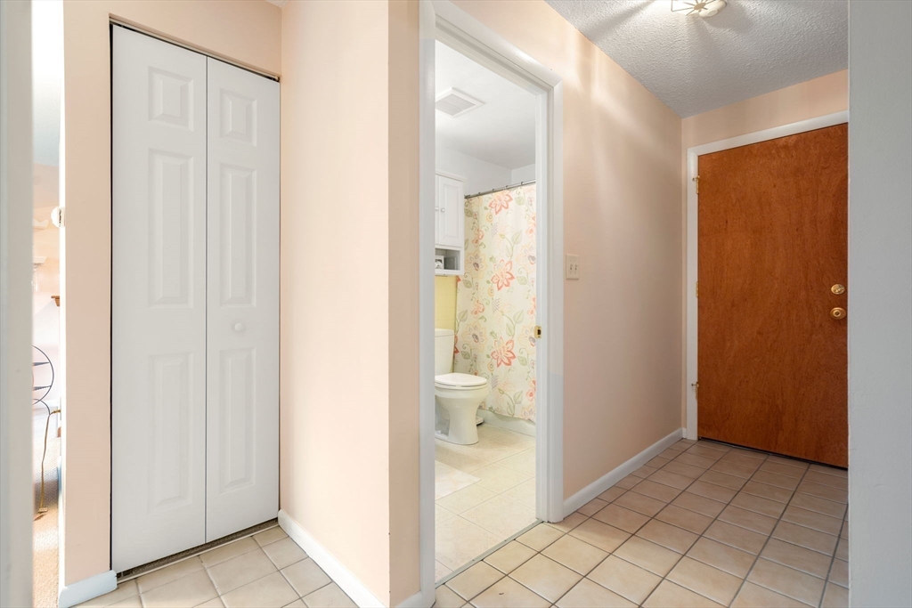 62 Purchase Street, Unit C5 Danvers, MA 01923 - Photo 18 of 22 a bathroom with a glass shower door