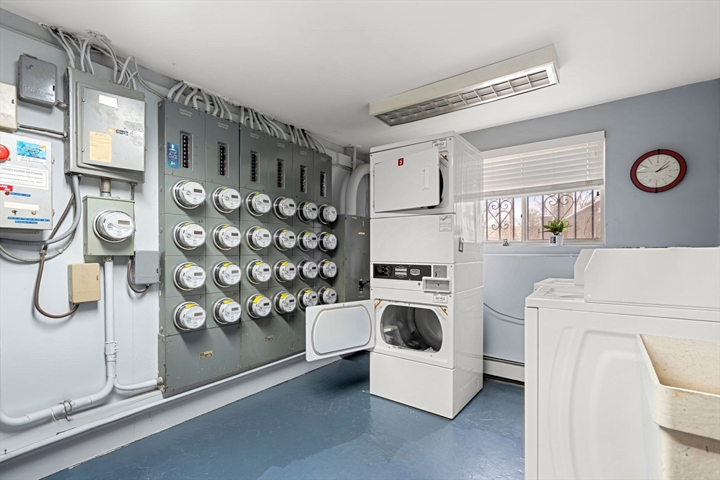 62 Purchase Street, Unit C5 Danvers, MA 01923 - Photo 20 of 22 a kitchen with a refrigerator and a stove top oven