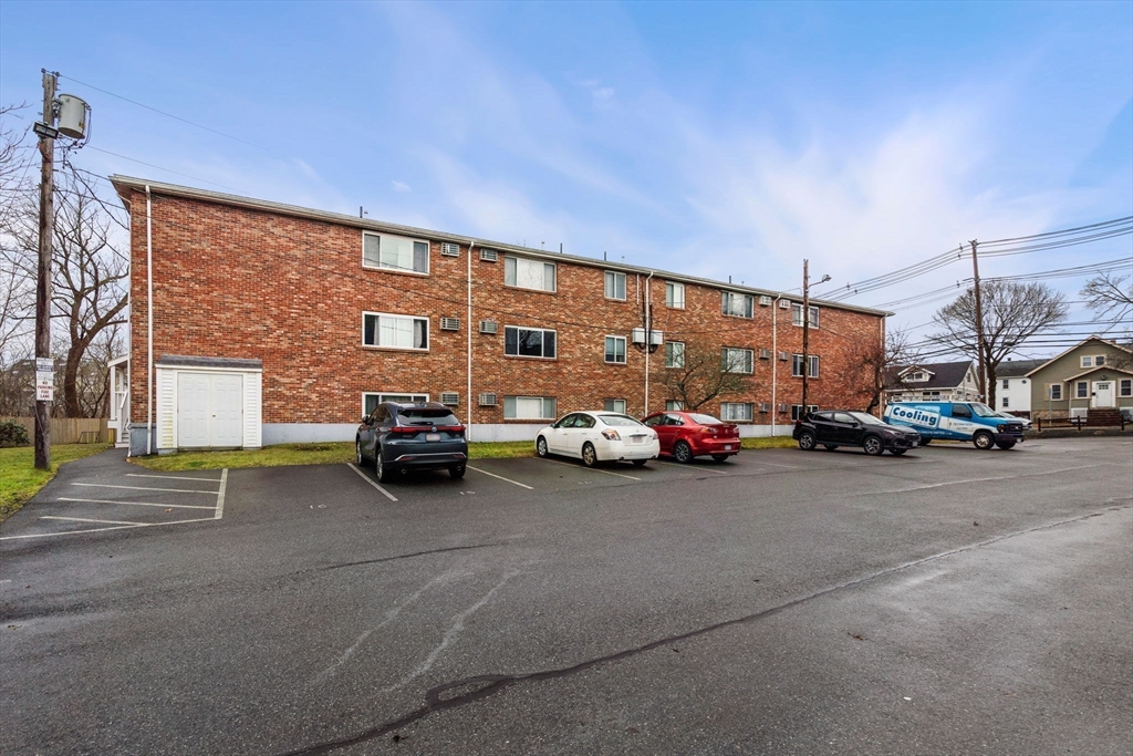 62 Purchase Street, Unit C5 Danvers, MA 01923 - Photo 22 of 22 a view of a cars park in front of house