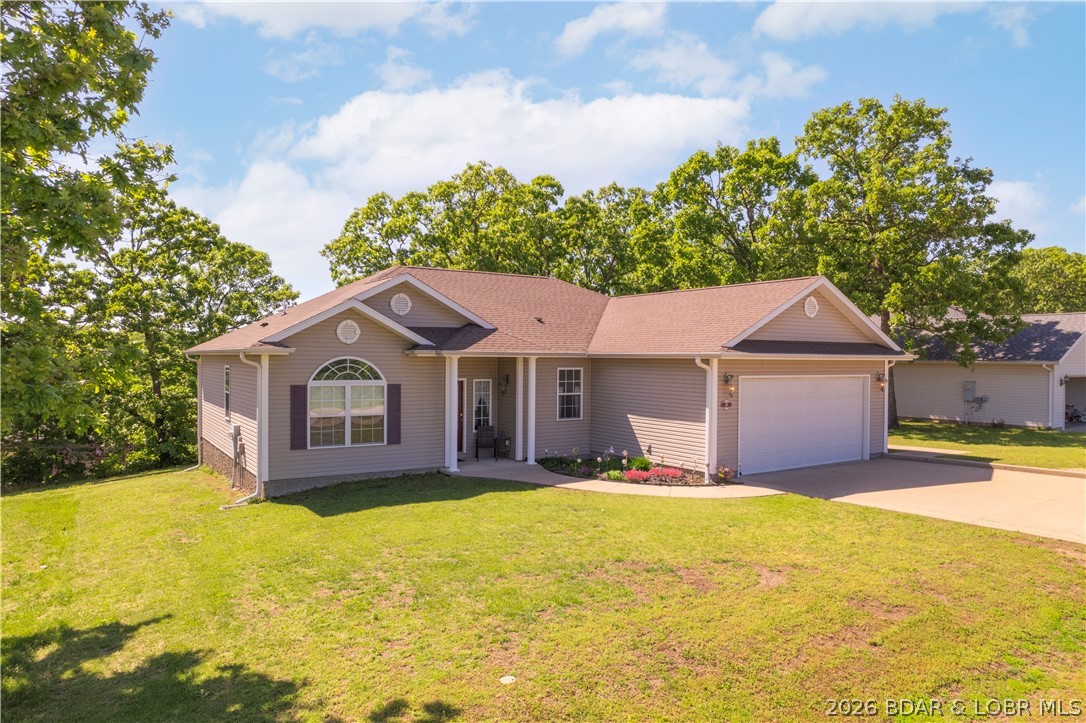 221 Whispering Streams Road Lake Ozark, MO 65049 - Photo 2 of 37