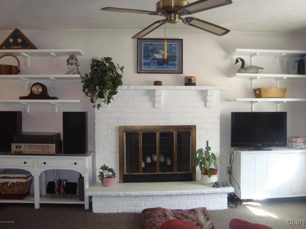 Living Room with Brick Fireplace