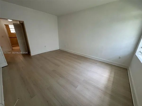 an empty room with a fireplace