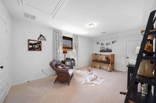 a bed room with furniture and a table